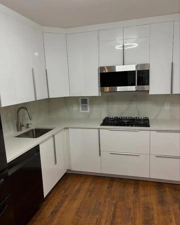 Restored kitchen with white cabinets after water damage in Woodlawn